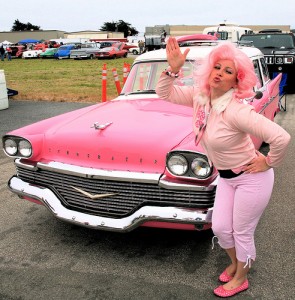 lady-in-pink-posing-next-to-pink-cadillac